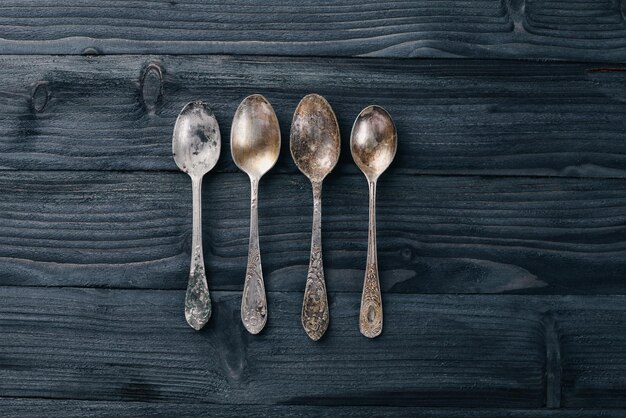 Old cutlery On a wooden background Top view Free space for text