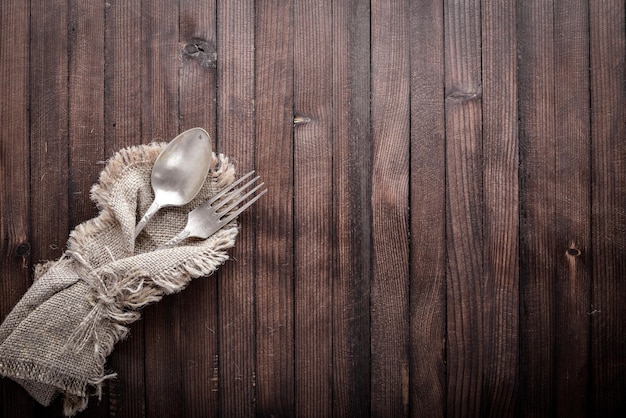 Old cutlery On Wooden background Top view