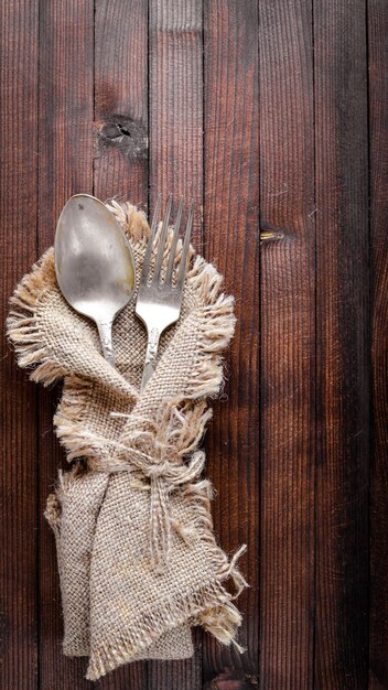 Old cutlery On Wooden background Top view