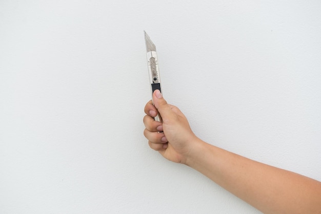 Old cutter in hand on white background