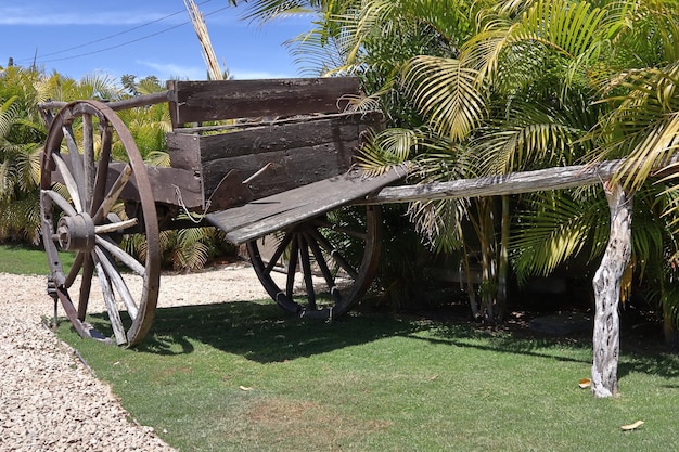 Old dilapidated cart exhibited as decoration in a public park