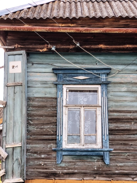 Old dilapidated retro house in sunny weather