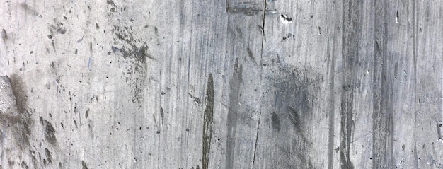 Old dirty concrete wall as a background Gray cement plaster Wall texture for background Brush scratches on the wall