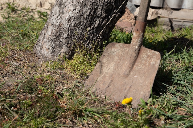 Old dirty shovel used in construction or agriculture