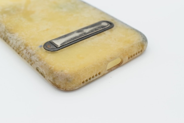 Old and dirty silicon phone case due to yellow stains and mold