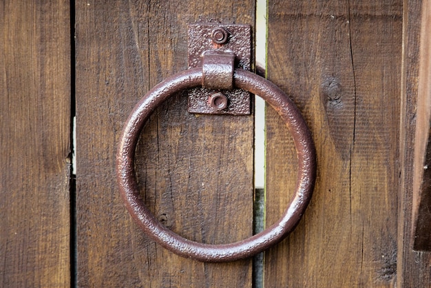 Old door handle in the form of a ring