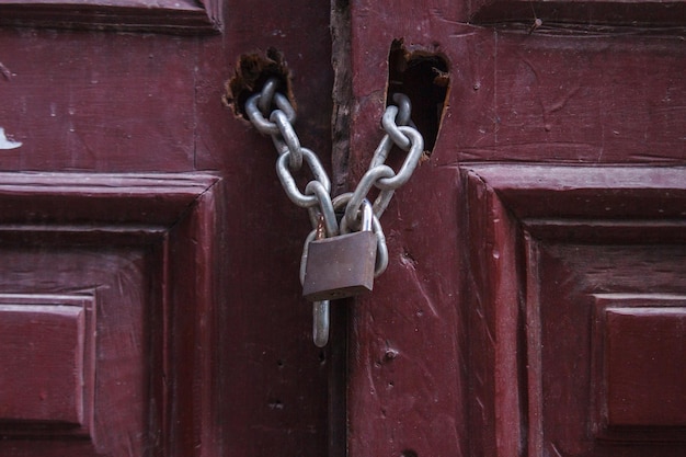Old door locked with padlock in a street in Rio de Janeiro Brazil