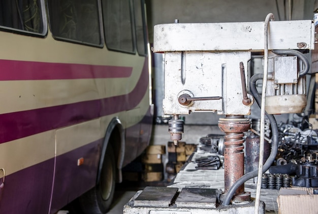 Old Drilling Machine in a Car Repair Shop