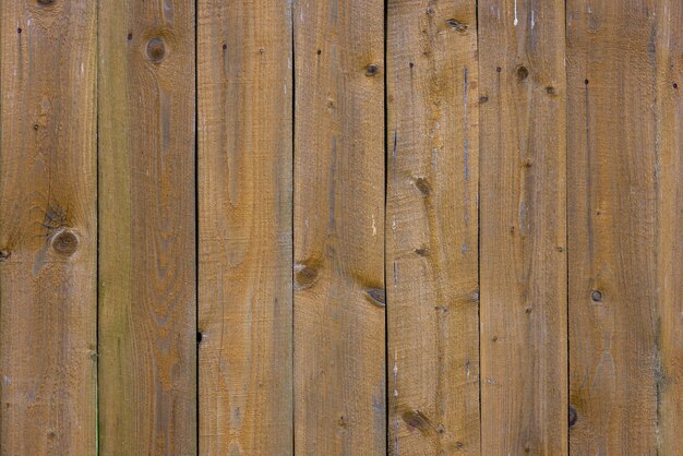 Old dry weathered gray and brown wooden planks board surface full frame background and texture