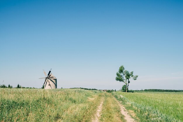 Old dutch windmill on field