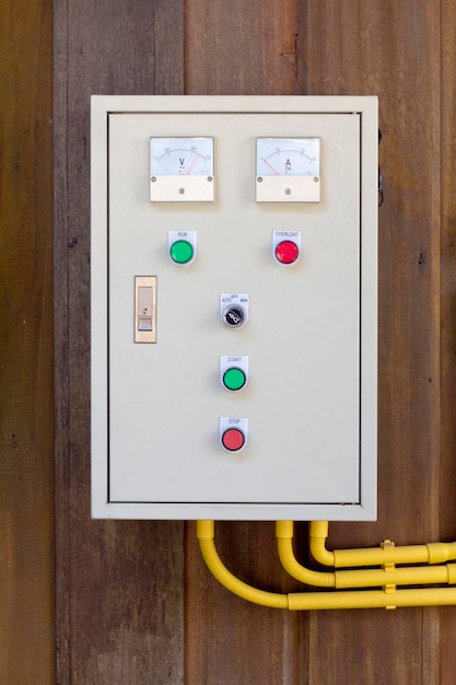 Photo old electric control box on wooden wall