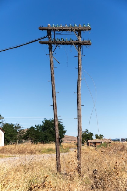 An old electric pole in front of the old train station in Monreal del Campo Teruel Spain