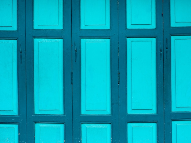 Old emerald green painted wooden door background. Old emerald green painted wooden door background.