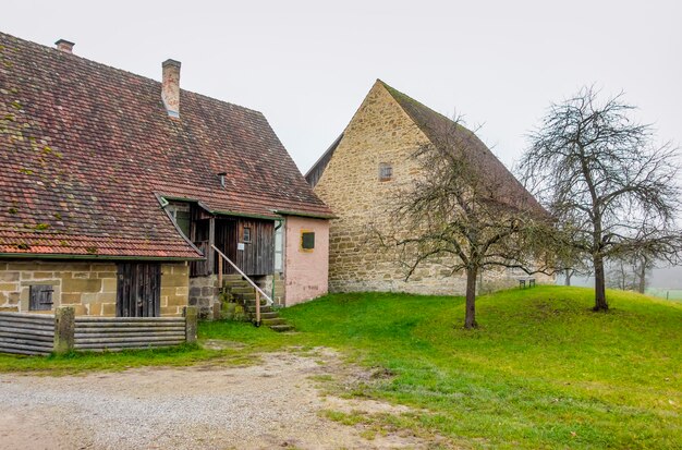 old farmhouse at autumn time