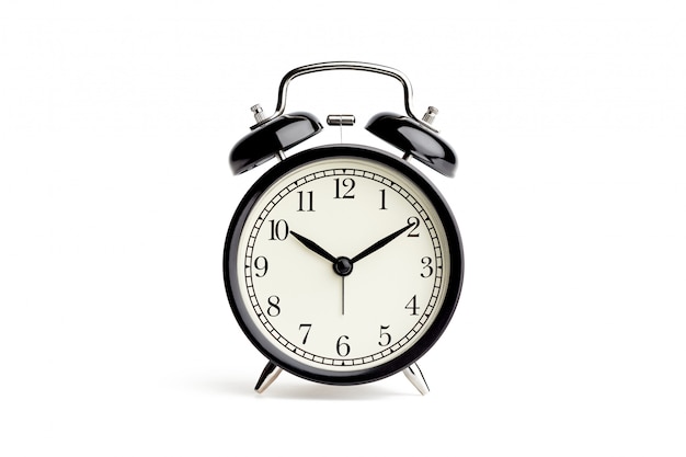 Old fashioned alarm clock on white