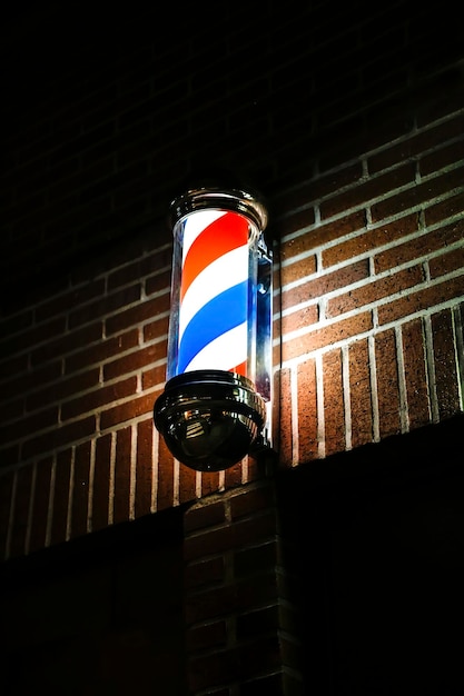 Old-fashioned barber pole in the night