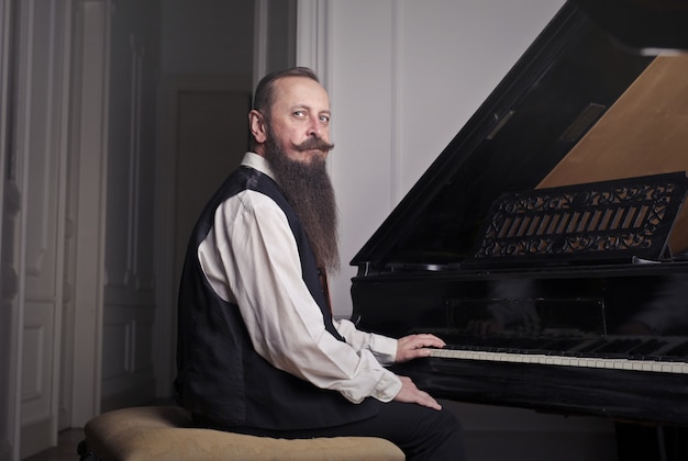 Old-fashioned man with a piano