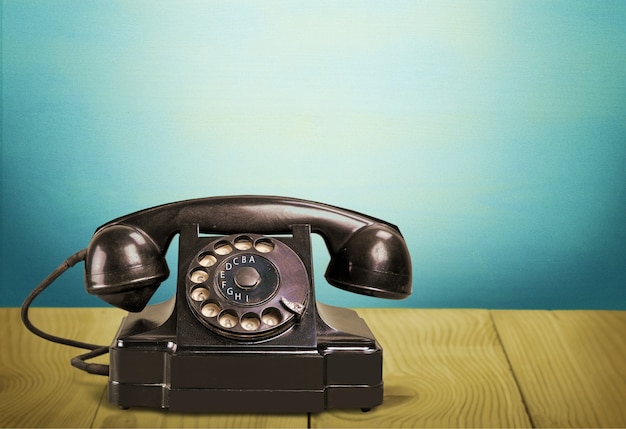 old fashioned phone  on background