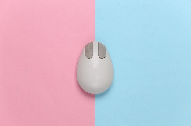 Old-fashioned retro pc mouse on pink blue