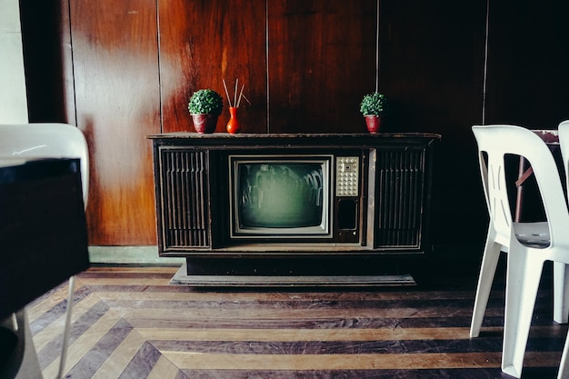 old-fashioned television set in cabinet at home