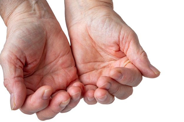 Old female hands holding something. Isolated on white.