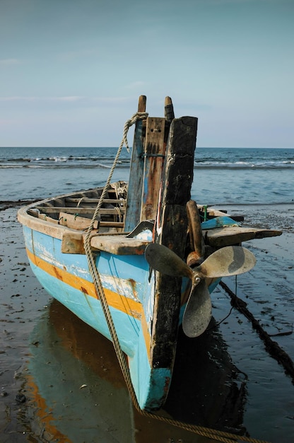 old fishing boat at the beach