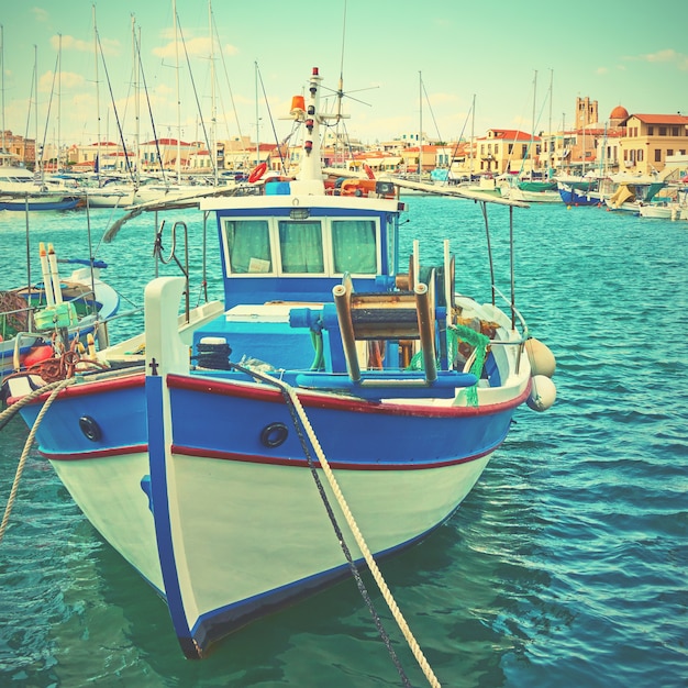 Old fishing boat in the port of Aegina, Greece. Vintage style toned