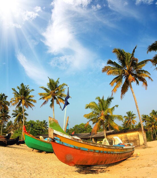 Old fishing boats on beach in india