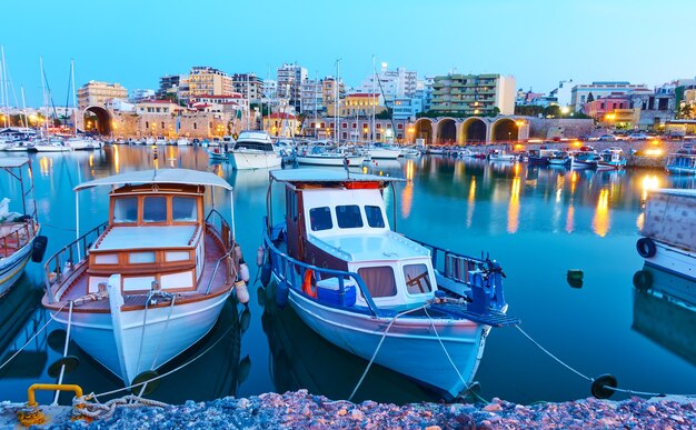 Old fishing boats in port of Heraklion in the evening,  Crete, Greece