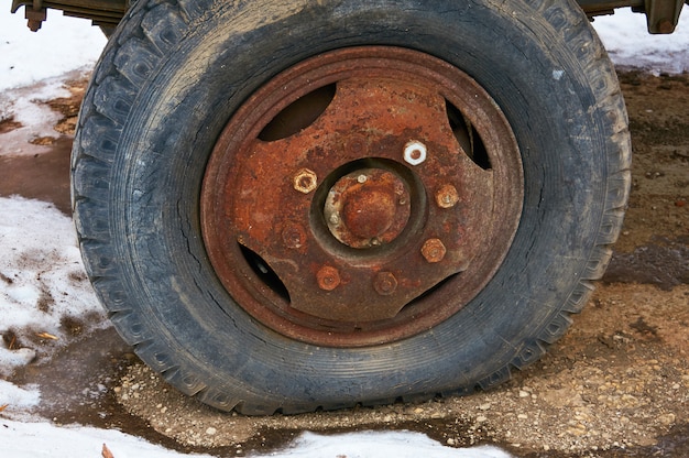 Photo old flat tire cracked from a big car.