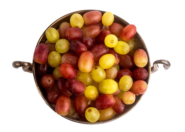 Old fruit bowl with grapes.