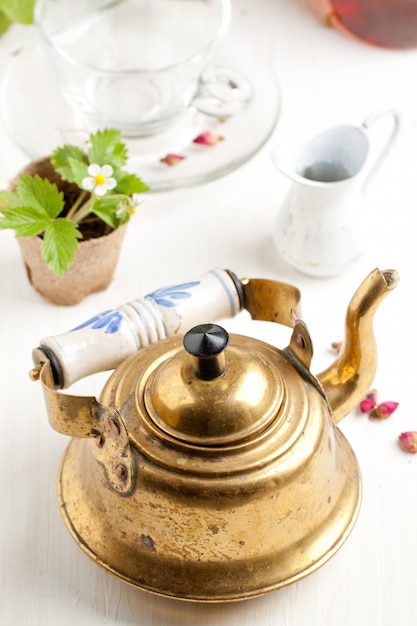 Old golden teapot