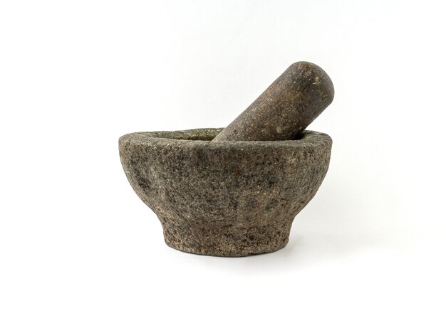 Old granite pestle and mortar isolated on white background.