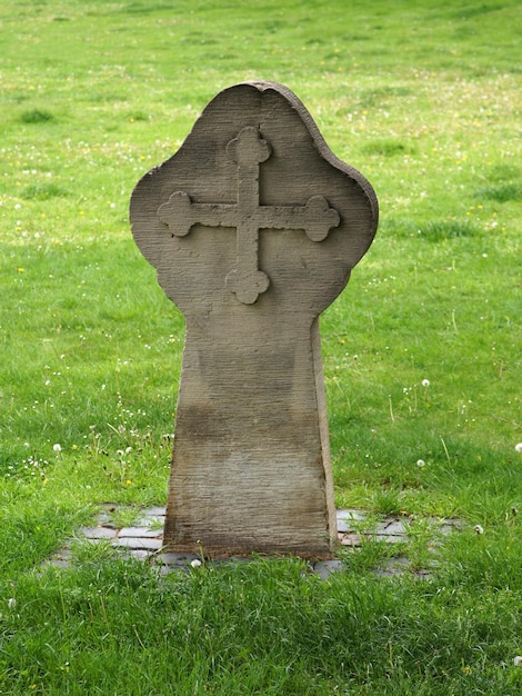 Old grave stone with cross