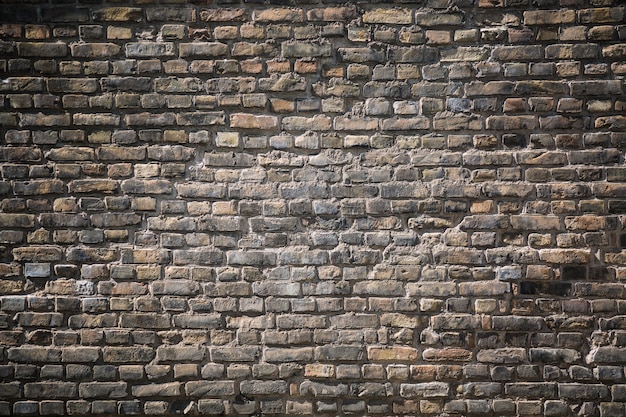 Old grey brick wall texture background.