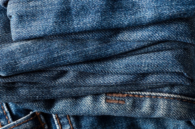 Old grunge blue jeans texture background