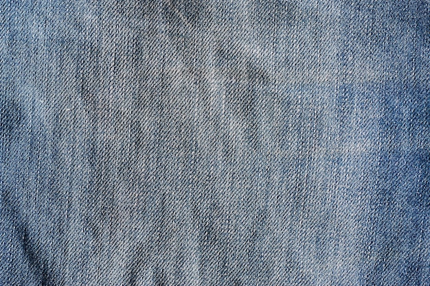 Old grunge blue jeans texture background