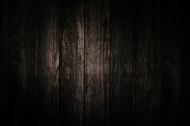 An old grunge dark textured wooden background