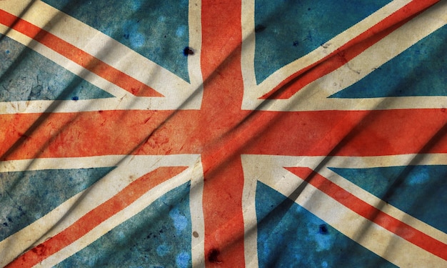 Old grunge vintage dirty weathered damaged UK Great Britain national flag symbol of British patriotism full frame background