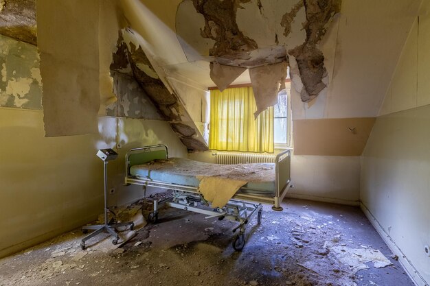 Old hospital bed in a rotten room