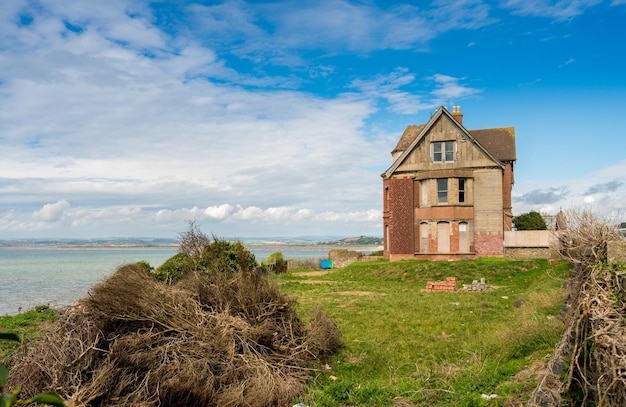 Old house on cliffs outside Westward Ho in Devon