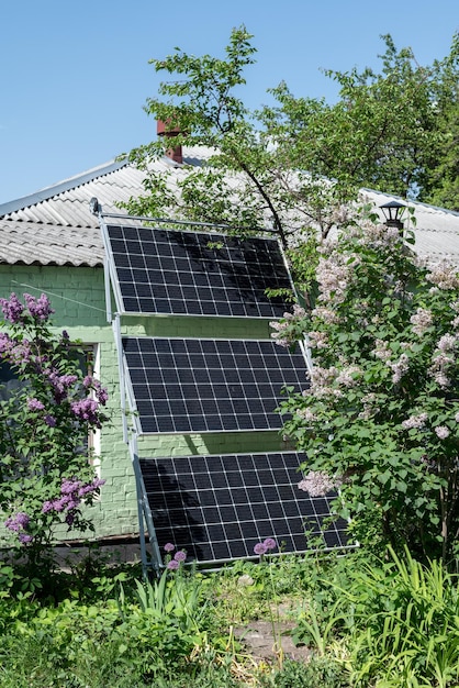 Old house with a solar panel in nature Photovoltaic panels on the roof Saving electricity