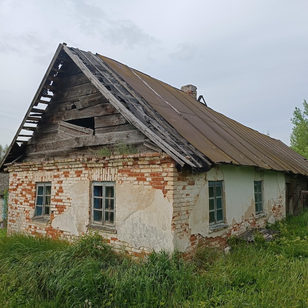 An old house with the word " house " on the side.