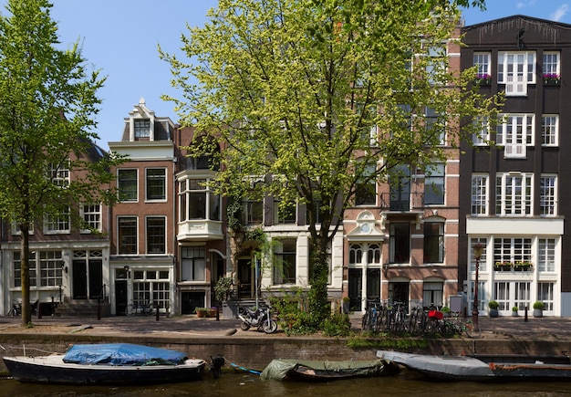 Old houses over canal  in Amsterdam, Netherlands