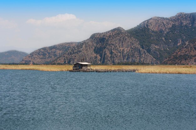 Photo old hut beside river at countryside photo