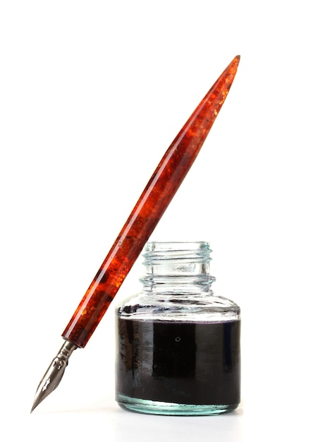 Photo old ink pen and ink bottle isolated on white