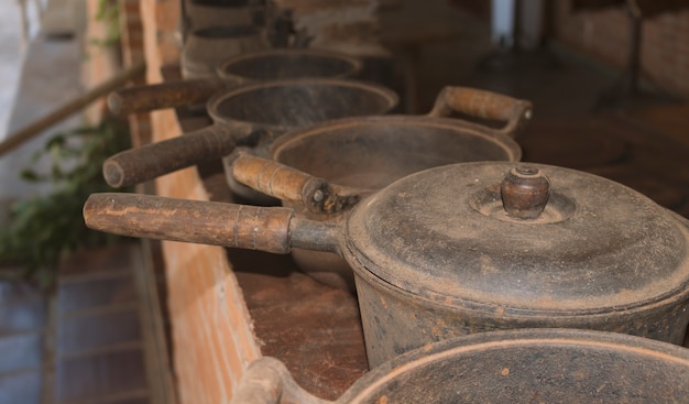 Old iron and wood pans on a table