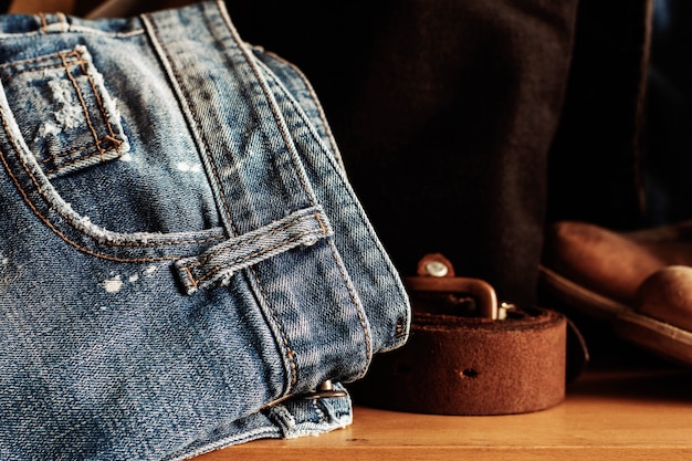 Old jeans on wooden.