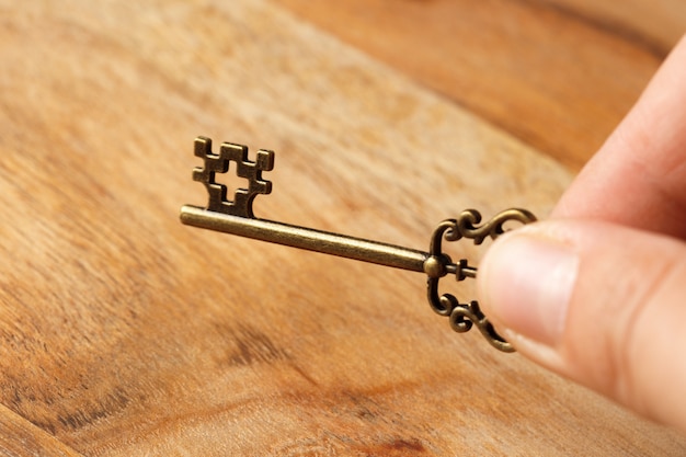 Old key on wooden table