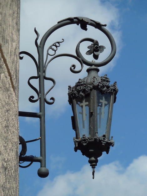 Old lantern on the wall in front of the church